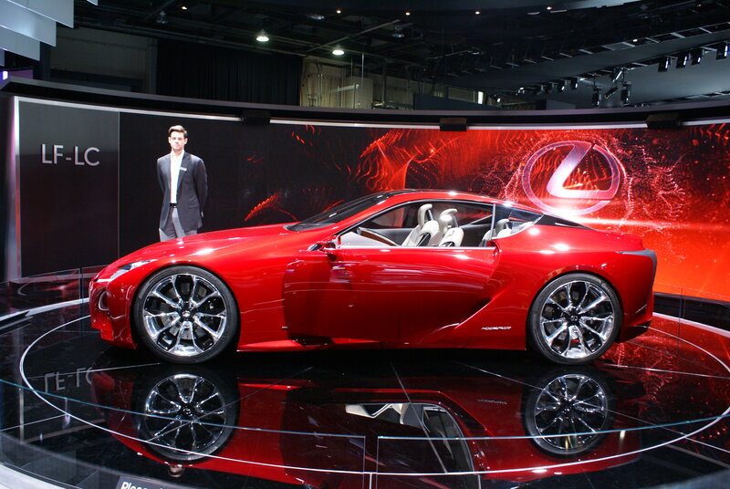 Red Lexus Concept Car — Dramatic, Photograph, Man in Suit, Car Display