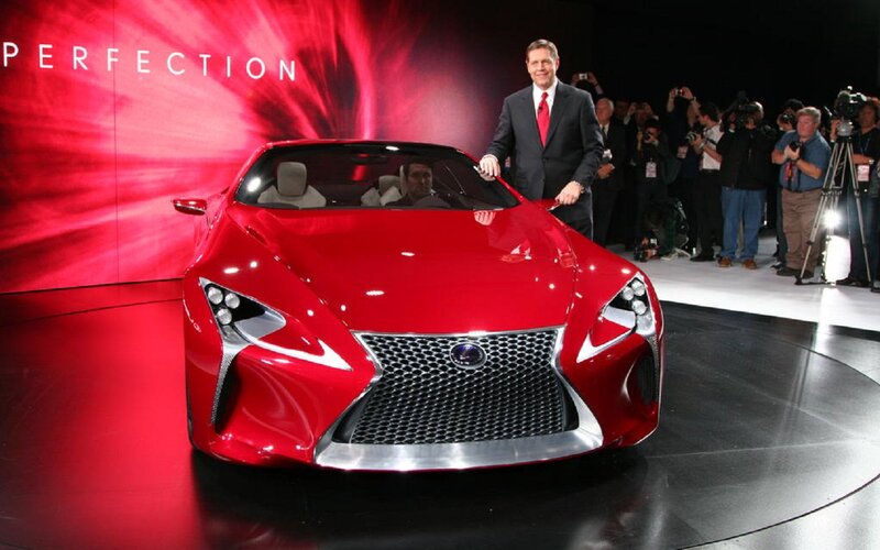 Red Lexus Concept Car — Dramatic, Photograph, Man in Suit