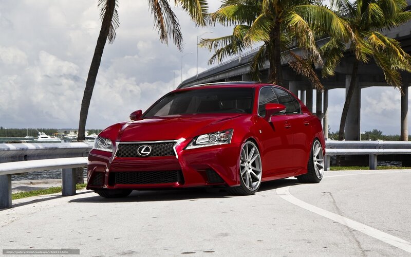 Red Lexus GS-F on a coastal road