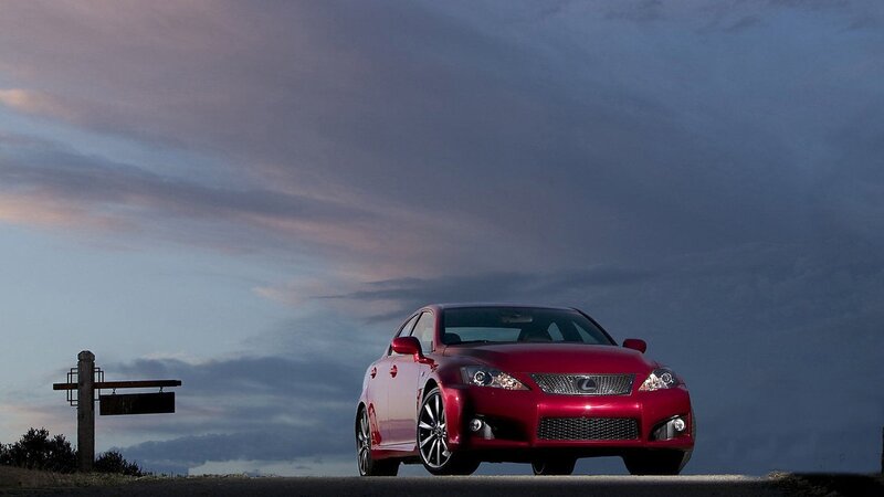 Red Lexus IS at dusk