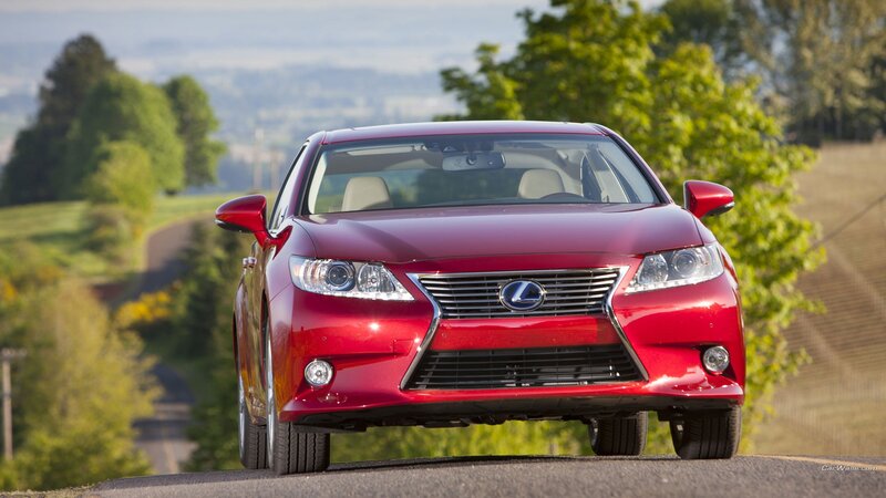 Red Lexus sedan on a country road