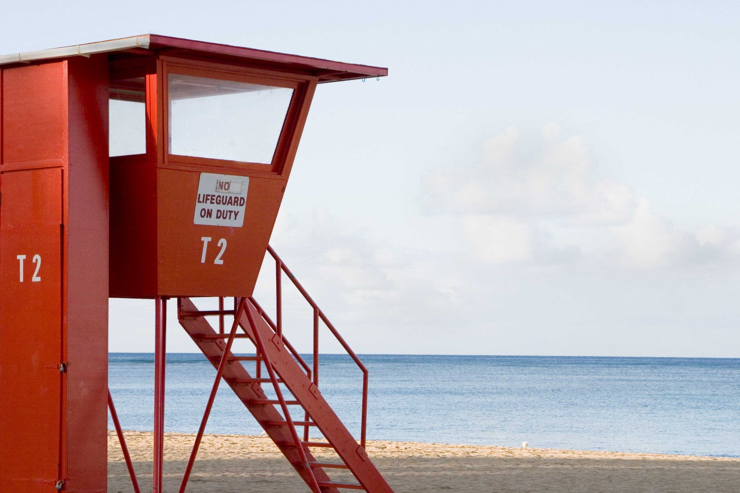 Red lifeguard tower on beach