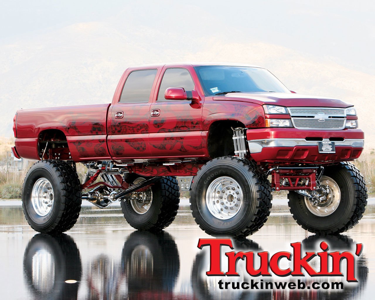 red lifted truck with decals