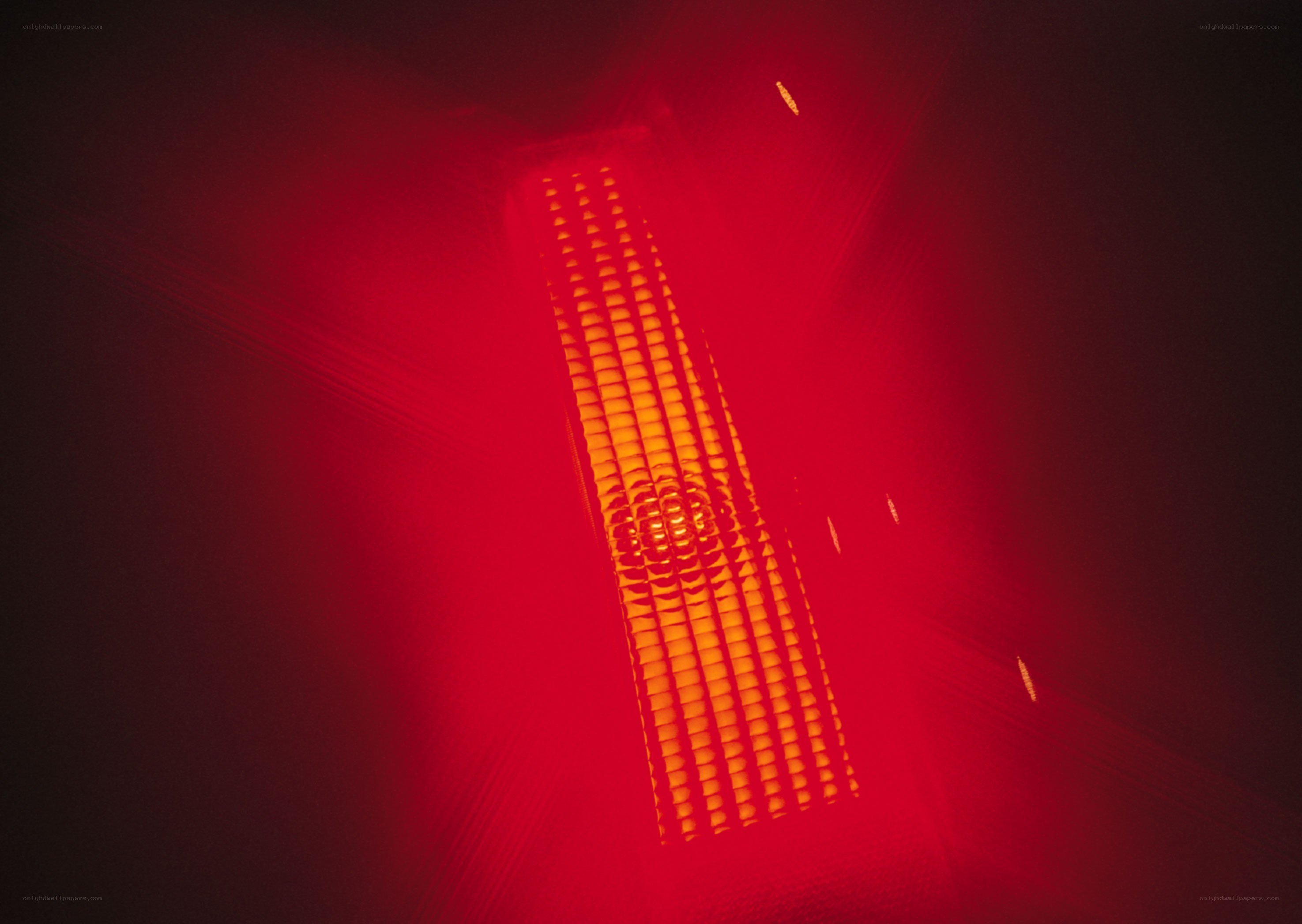 Red light fixture in dark room