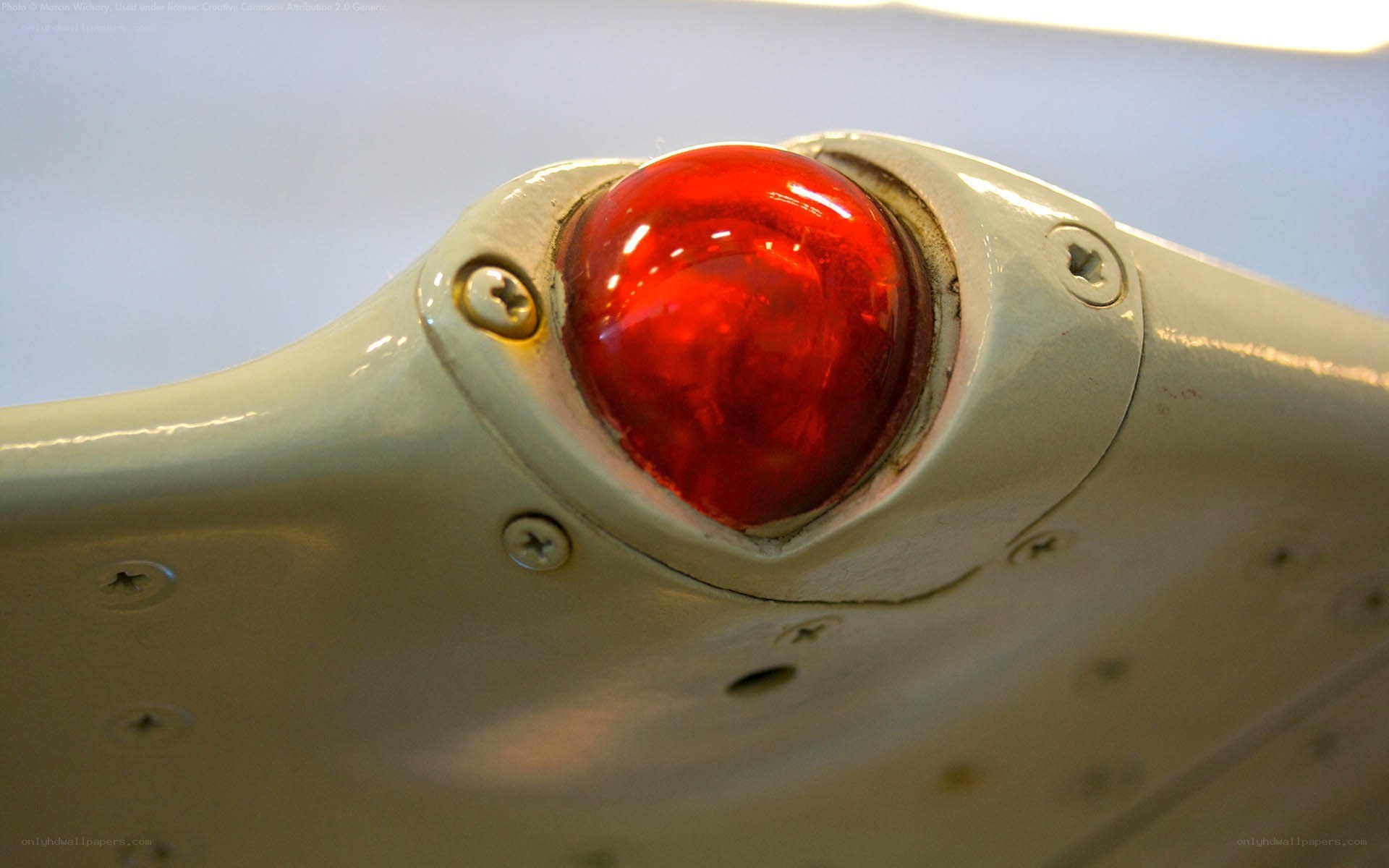 red light on aircraft wing