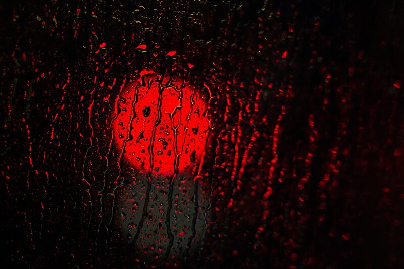 Red Light Through Raindrops — Dramatic