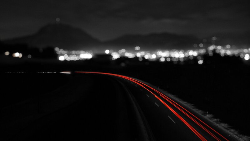 Red Light Trails on Road — Photograph
