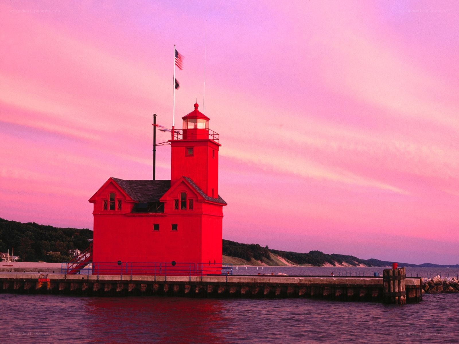 Red lighthouse at sunset