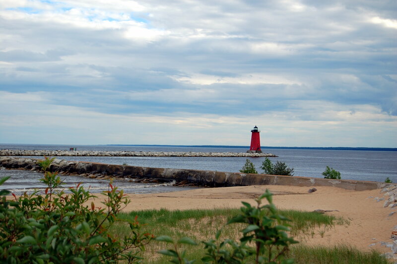 Red lighthouse at the harbor entrance