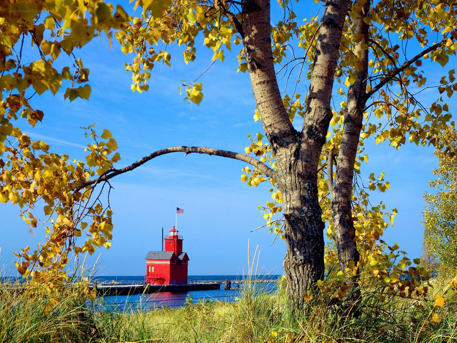Red lighthouse in autumn