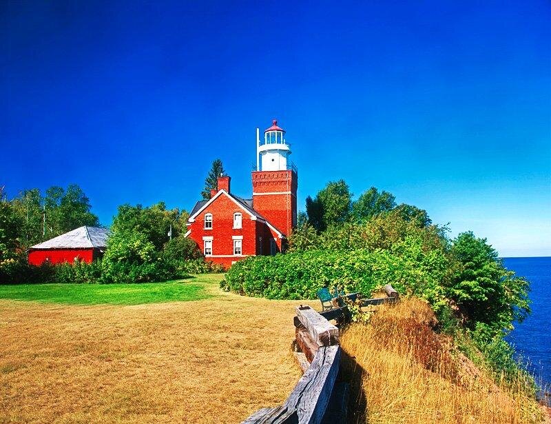 Red Lighthouse on Cliff