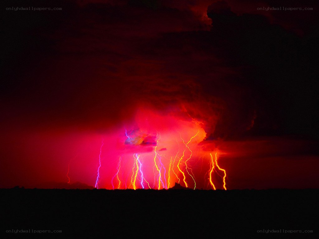 Red lightning storm at night