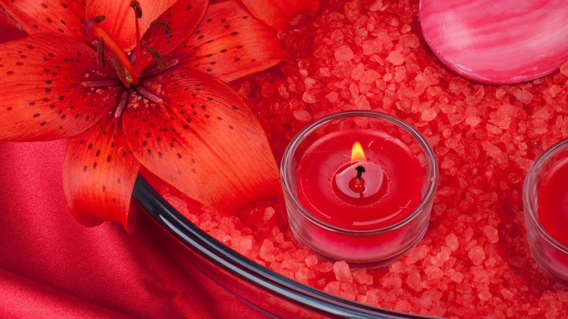 Red lily and candle arrangement
