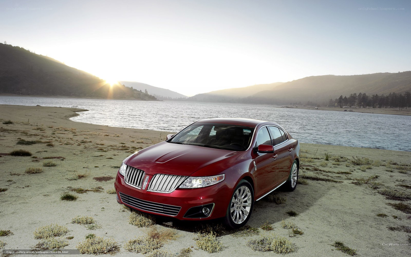 Red Lincoln on a lakeside beach