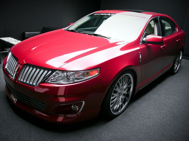 Red Lincoln sedan in showroom
