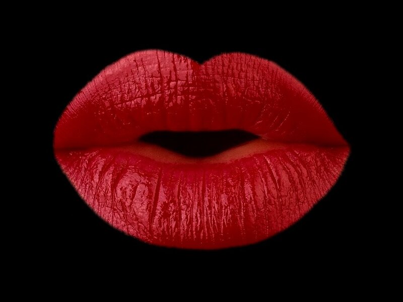 Red Lips on Black Background — Dramatic