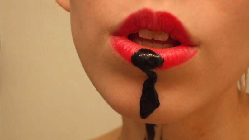 red lips with black substance