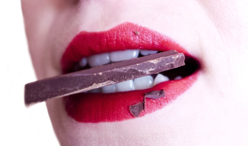 red lips with chocolate bar