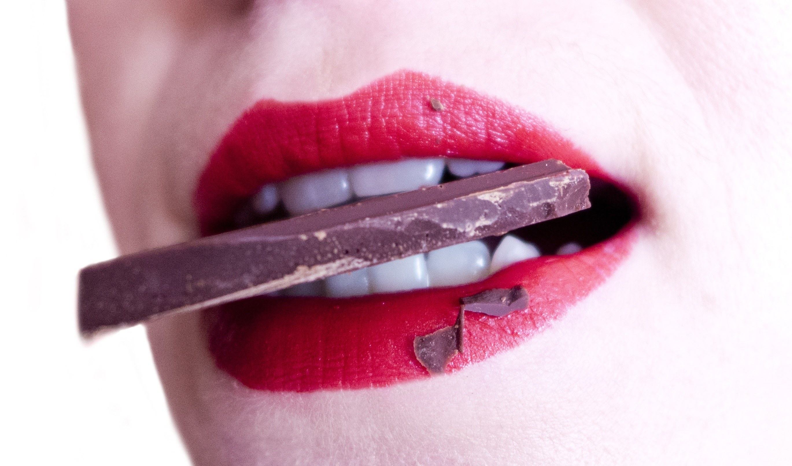 red lips with chocolate bar