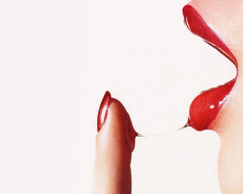 red lipstick and finger