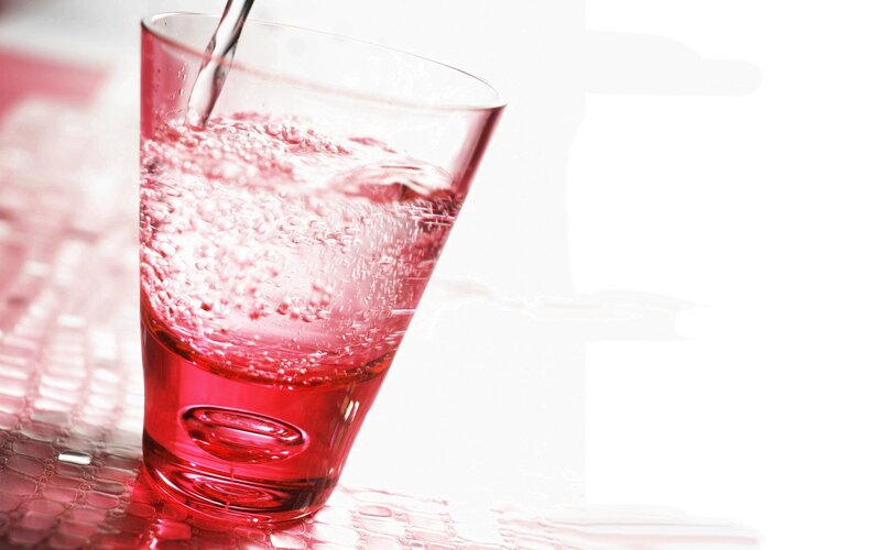 red liquid being poured