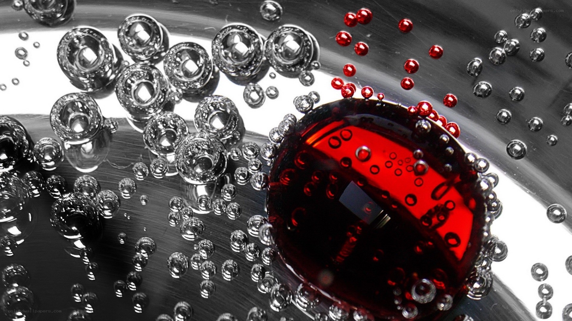 Red liquid bubbles on metal