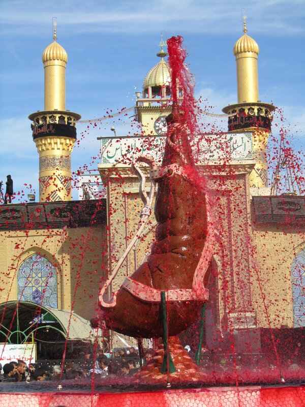 Red liquid fountain at shrine