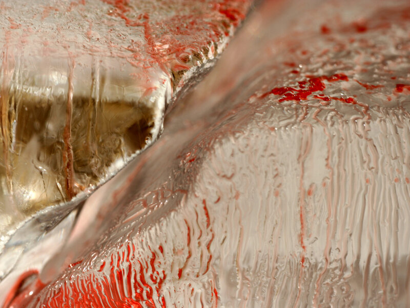 Red liquid on ice surface