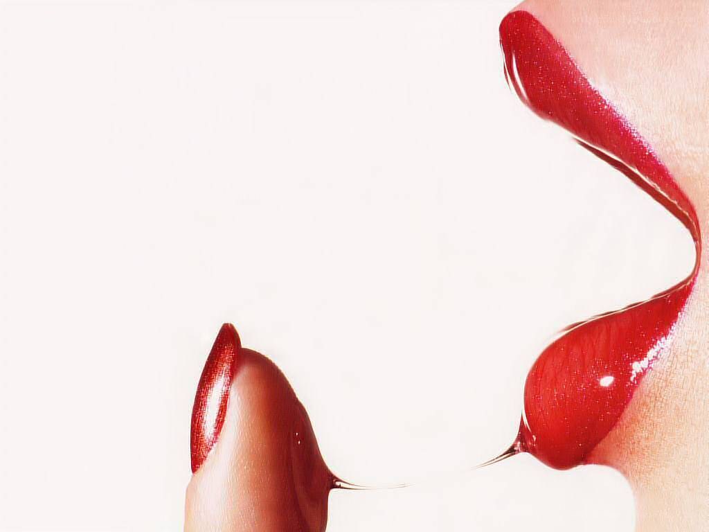 red liquid on lips and finger