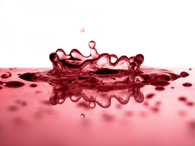 red liquid splash in slow motion