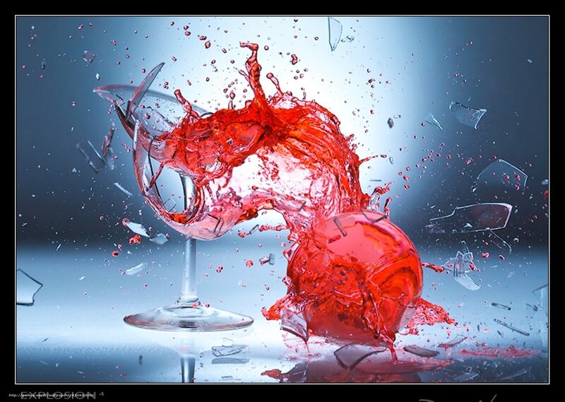 Red liquid splashing from broken glass