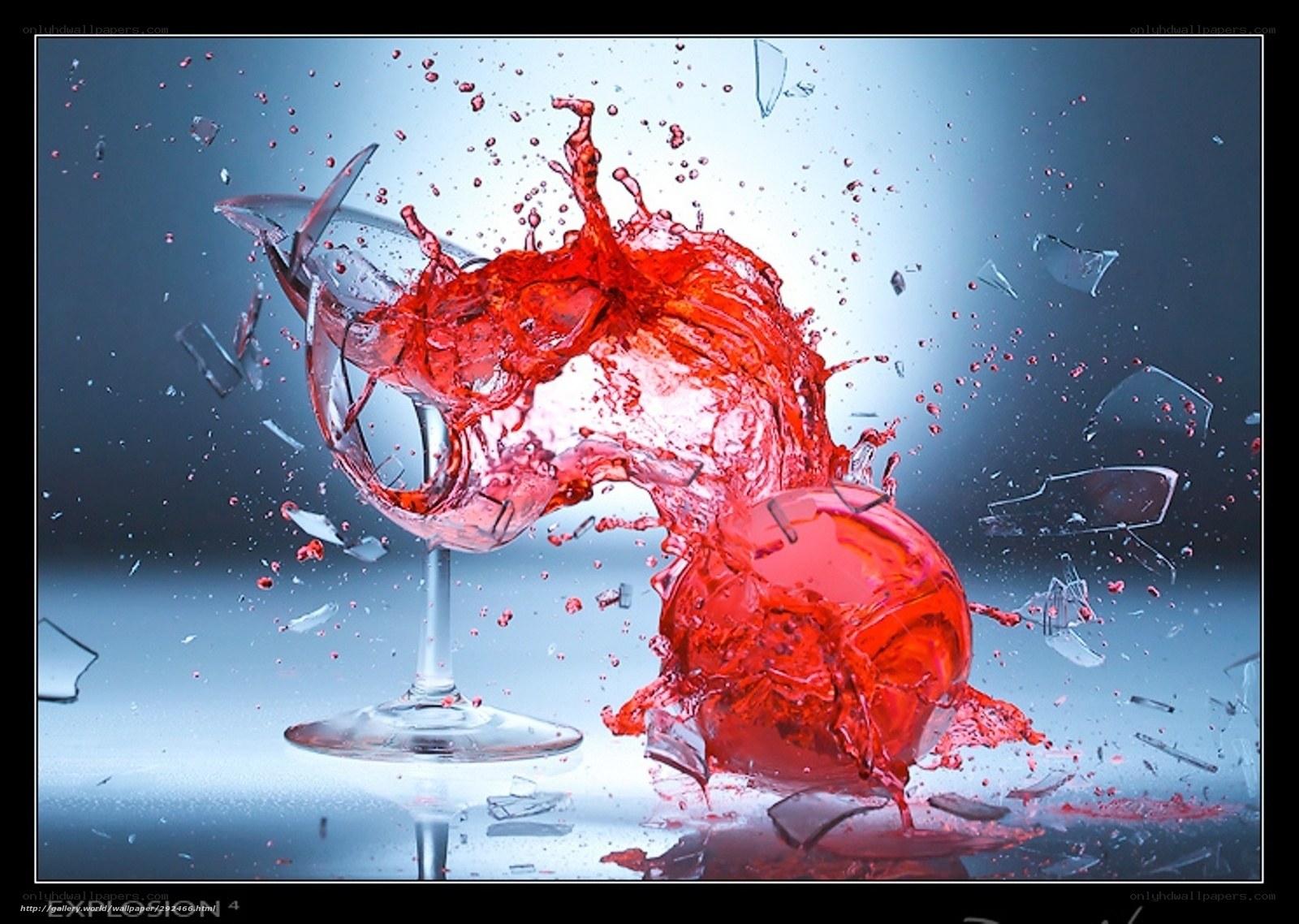 Red liquid splashing from broken glass