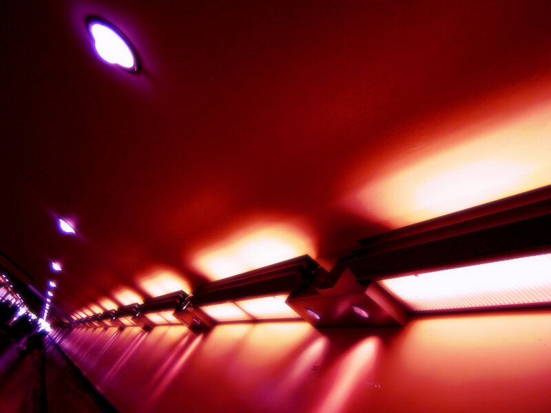 Red-lit corridor with lights