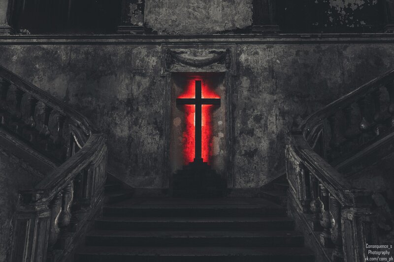 Red-lit Cross in Ruin