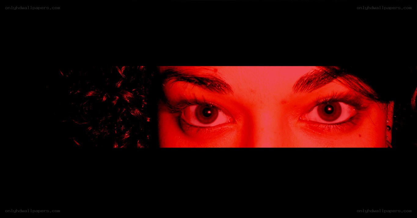 red-lit eyes in darkness
