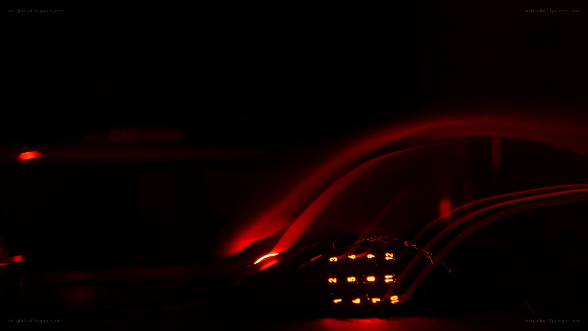 red-lit keyboard in dark room