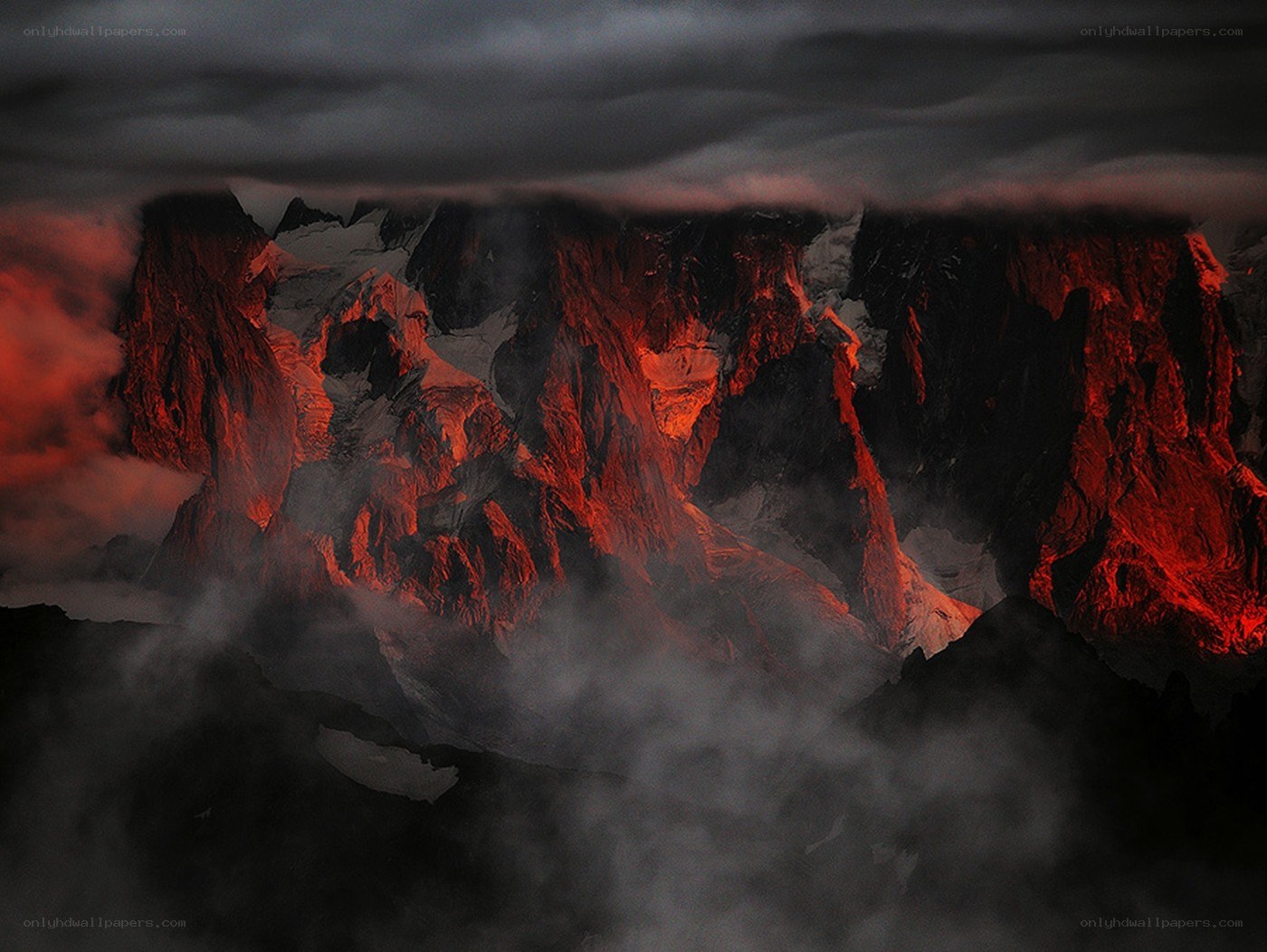 Red-lit mountain peaks at dusk