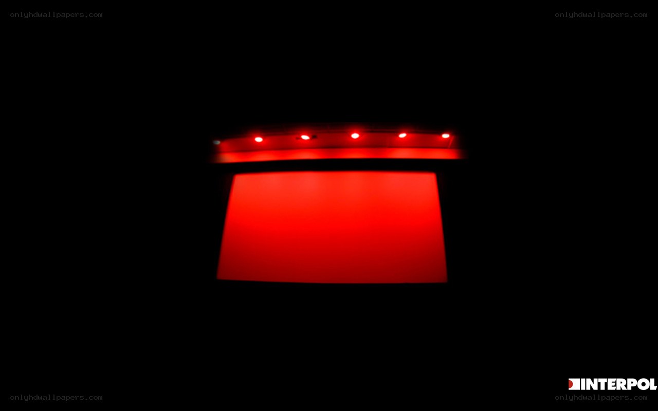 red-lit screen in dark room