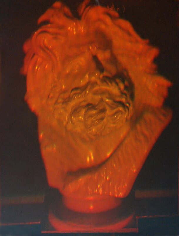 Red-lit sculpture bust