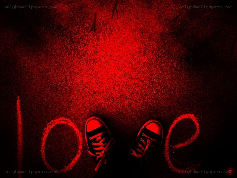 red-lit shoes on pavement