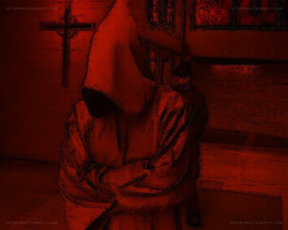 Red-lit statue in a church