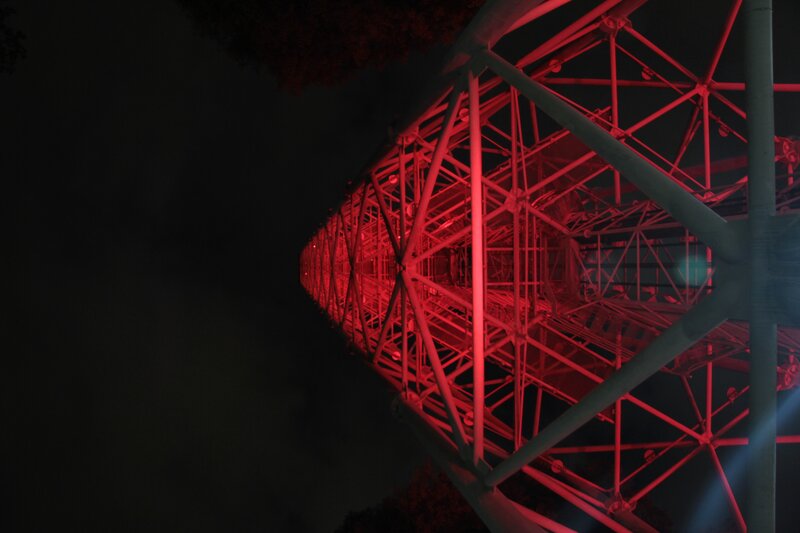 Red-lit tower at night