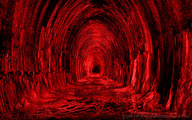 Red-lit tunnel corridor