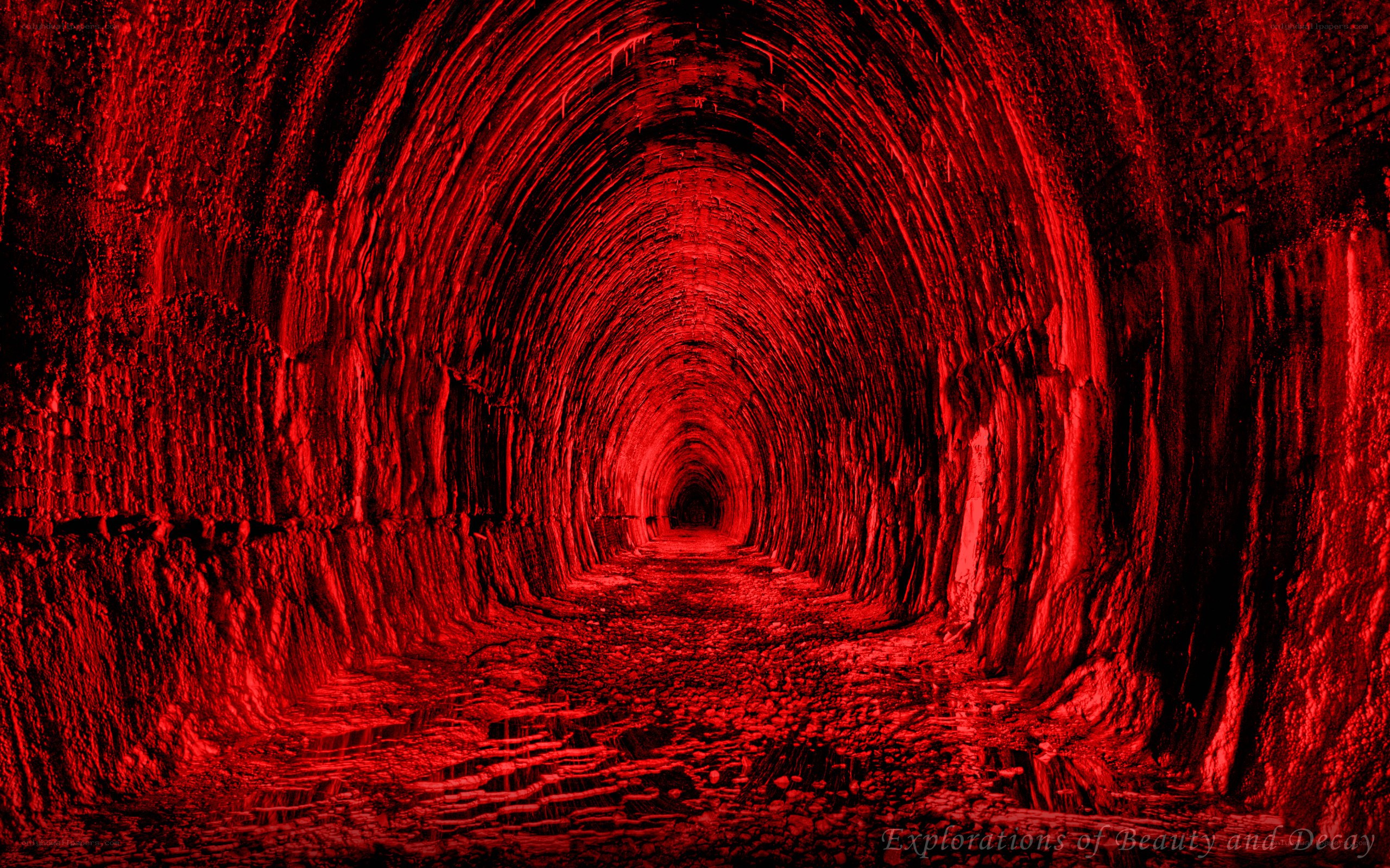 Red-lit tunnel corridor