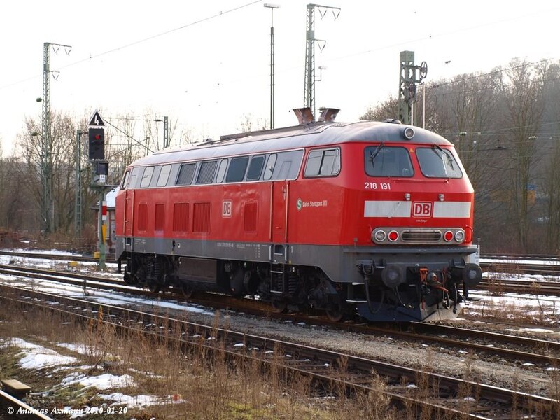 Red Locomotive on Tracks — Calm