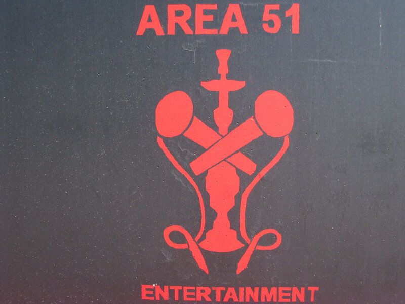 Red Logo on Dark Surface
