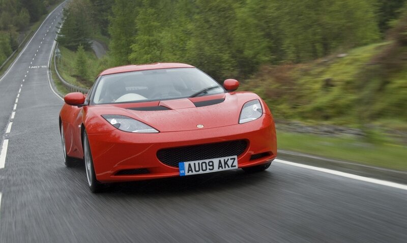 red lotus sports car on road