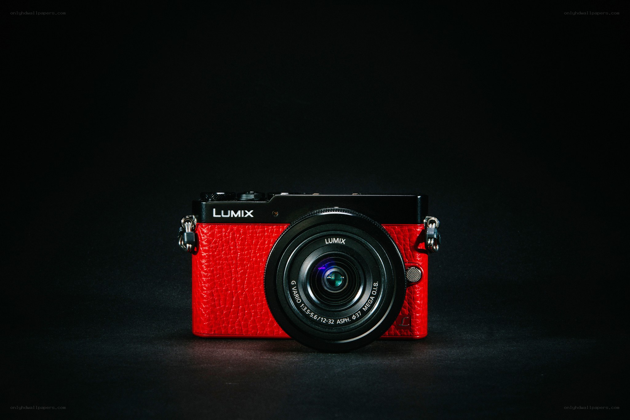 Red Lumix camera on black