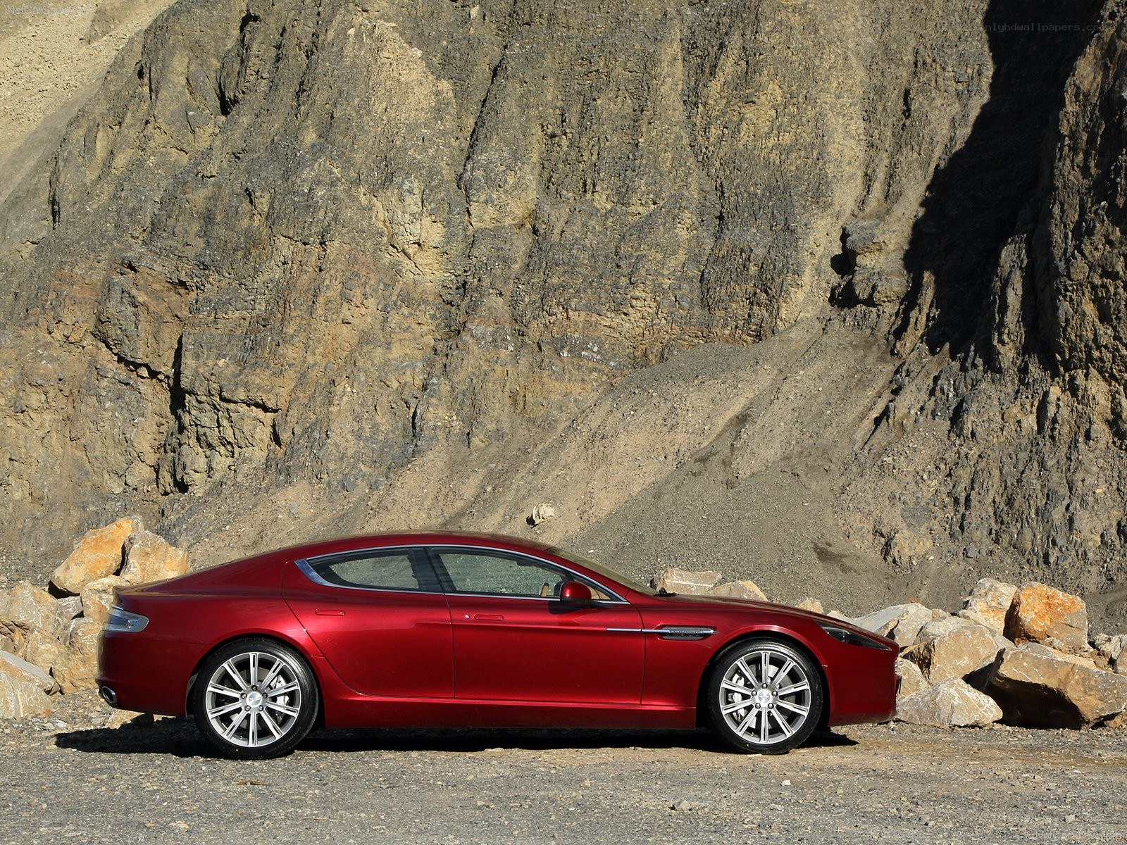 Red luxury car in desert