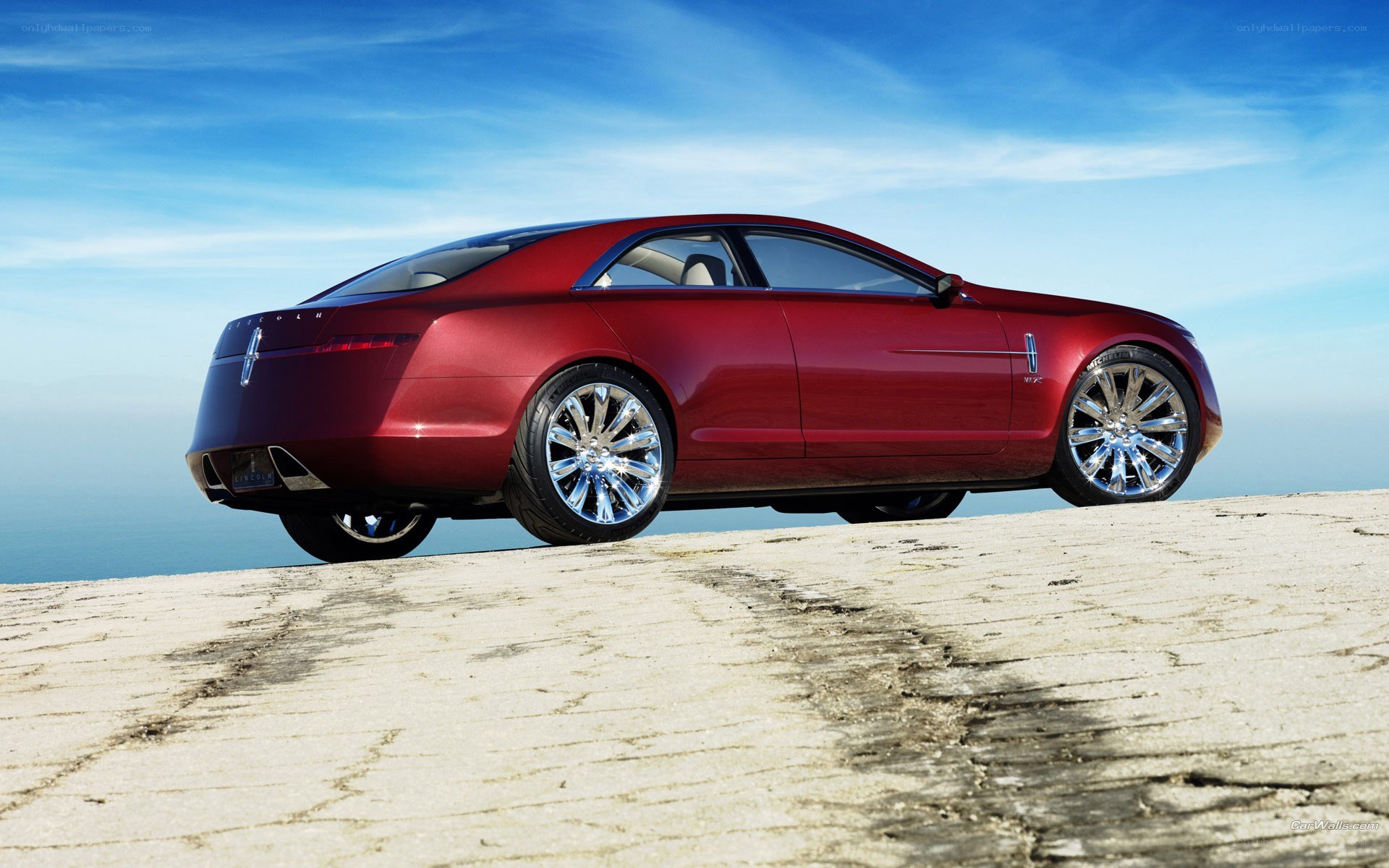 red luxury sedan on cliff